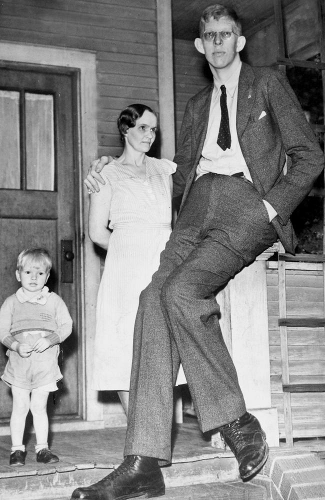 Robert Pershing Wadlow at age 17, with his mother, Addie, (and possibly his youngest brother) holds the Guinness World Record for the tallest person medically verified.