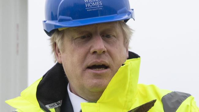 The election campaign is on for Boris Johnson, who spent time laying bricks this week. Picture: Dan Kitwood/AFP