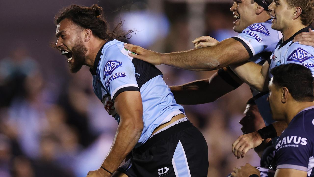 SYDNEY, AUSTRALIA - SEPTEMBER 10: Toby Rudolf of the Sharks celebrates with team mates after scoring a try during the NRL Qualifying Final match between the Cronulla Sharks and the North Queensland Cowboys at PointsBet Stadium on September 10, 2022 in Sydney, Australia. (Photo by Mark Kolbe/Getty Images)