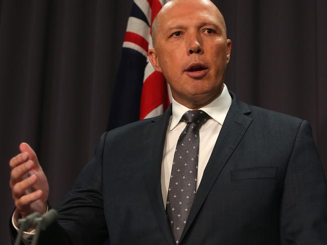 Minister for Home Affairs Peter Dutton with Commander of Operation Sovereign Borders Air Vice-Marshal Stephen Osborne at a Press Conference, Parliament House in Canberra. Picture Kym Smith