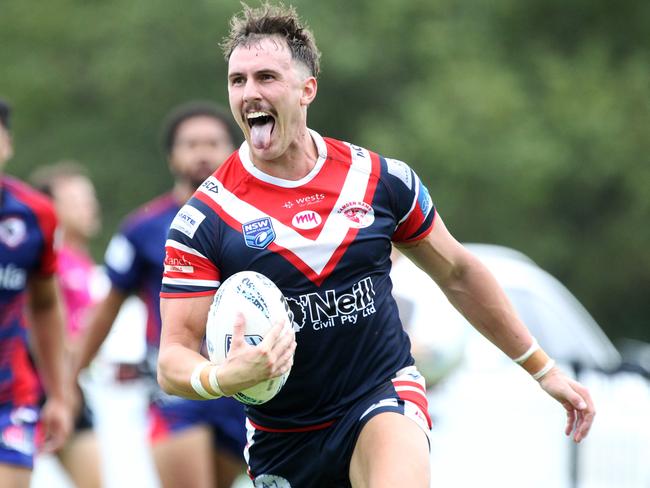 Blake Lindsay races across for one of his three tries.