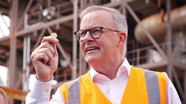 Anthony Albanese on the campaign trail in Gladstone on Thursday with his shiny dollar coin. Picture: Sam Ruttyn