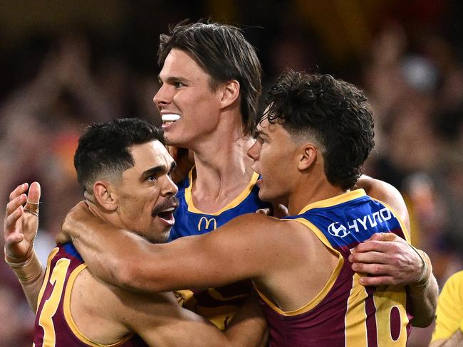BRISBANE, AUSTRALIA - SEPTEMBER 23: Charlie Cameron, Eric Hipwood and Cam Rayner of the Lions  celebrate a goal during the AFL Second Preliminary Final match between Brisbane Lions and Carlton Blues at The Gabba, on September 23, 2023, in Brisbane, Australia. (Photo by Quinn Rooney/Getty Images)