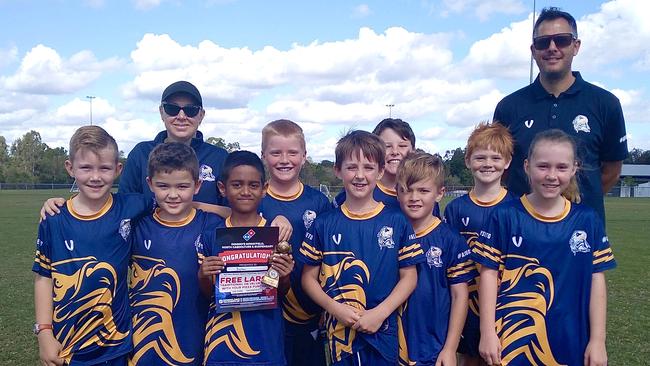 Darren Margin with one of his teams from Narangba Eagles Football Club. Photo: contributed.