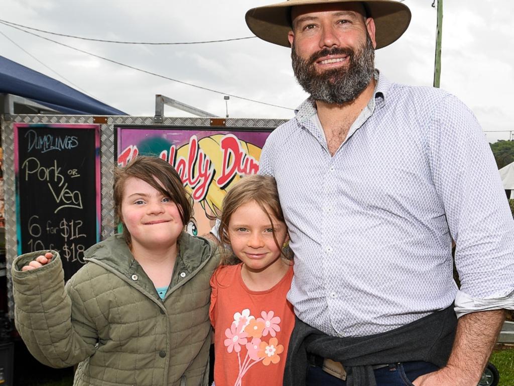 Dad Brett Wilkin with daughters Lilly and Elly ready to go get some chips at the Lismore Show. Picture: Cath Piltz