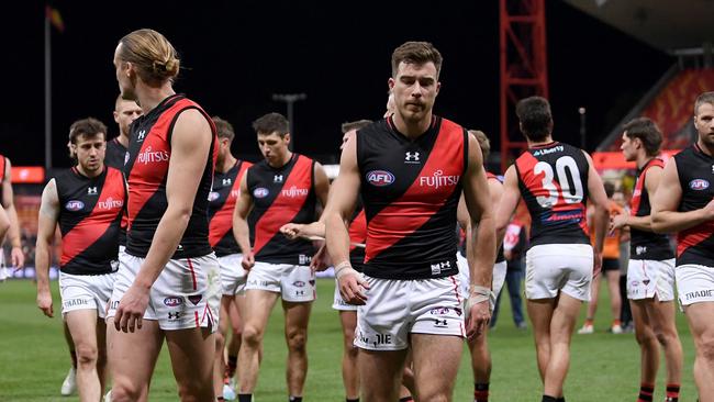 SYDNEY, AUSTRALIA – AUGUST 19: Mason Redman and Zach Merrett of the Bombers react following the 2023 AFL Round 23 match between the GWS GIANTS and the Essendon Bombers at GIANTS Stadium on August 19, 2023 in Sydney, Australia. (Photo by Morgan Hancock/AFL Photos via Getty Images)