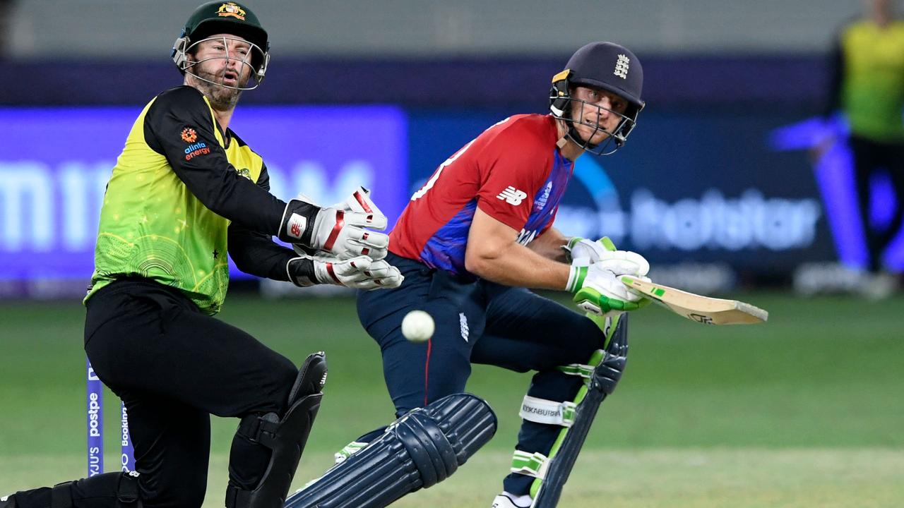 England's Jos Buttler plays a shot as Australia's wicketkeeper Matthew Wade