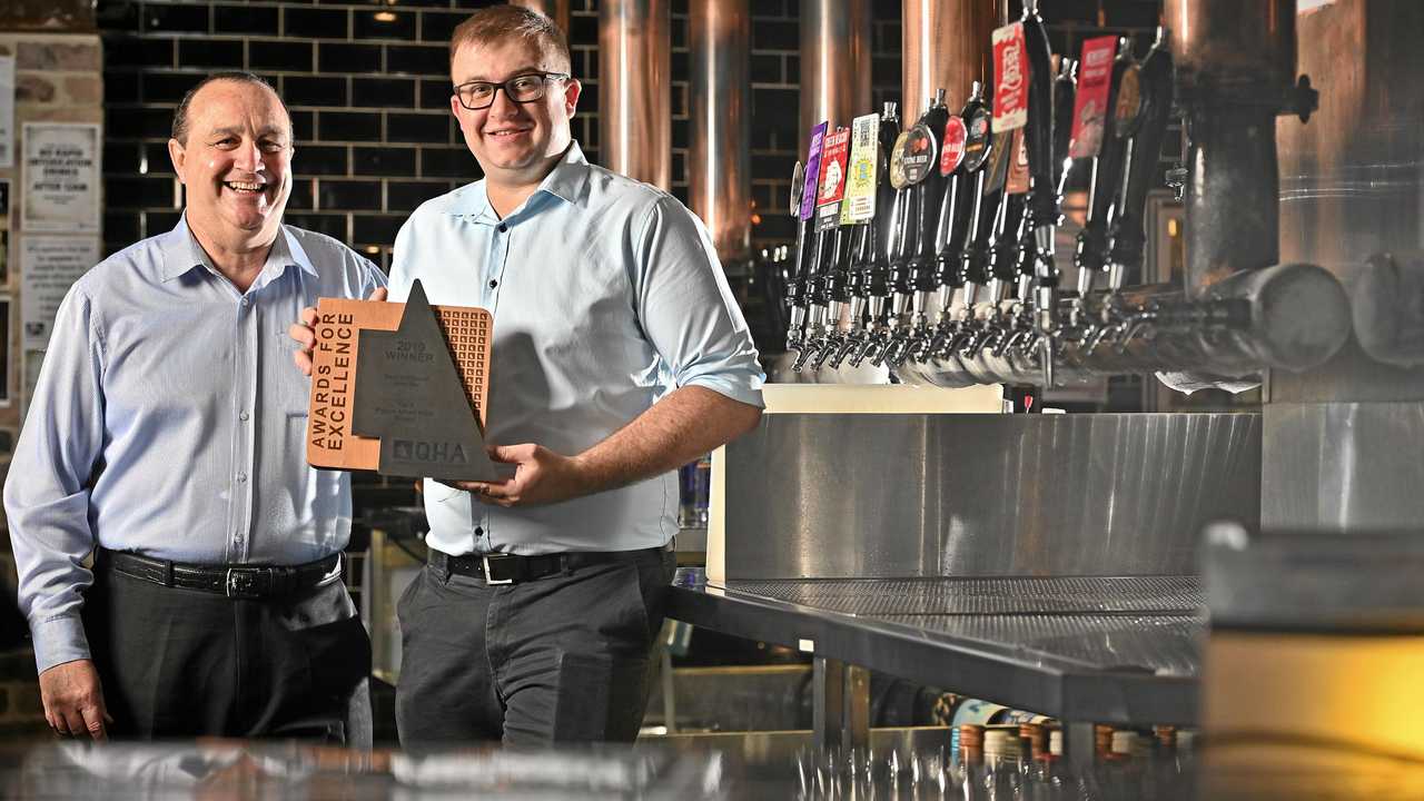 CHEERS: PA Hotel general manager Peter Coultas and operations manager Tim Rule celebrate the venue's latest success in the Queensland Hotels Association Awards. Picture: Cordell Richardson