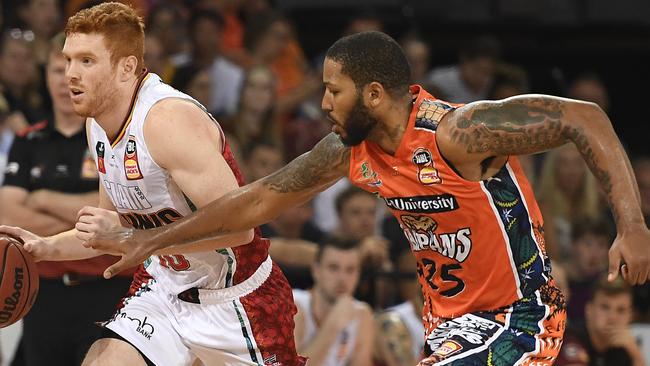 CAIRNS, AUSTRALIA – JANUARY 31: Angus Glover of the Hawks gets past DJ Newbill of the Taipans during the round 18 NBL match between the Cairns Taipans and the Illawarra Hawks at the Cairns Convention Centre on January 31, 2020 in Cairns, Australia. (Photo by Ian Hitchcock/Getty Images)