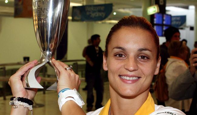 Women's Soccer. The Matildas arrive at Sydney airport after returning from winning the Asian Cup in China. Captain, Melissa Barbieri with the Trophy.