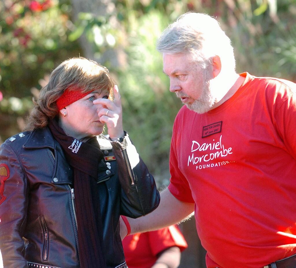 Bruce Morcombe supports wife Denise as she wipes away a tear at the Ride for Daniel.