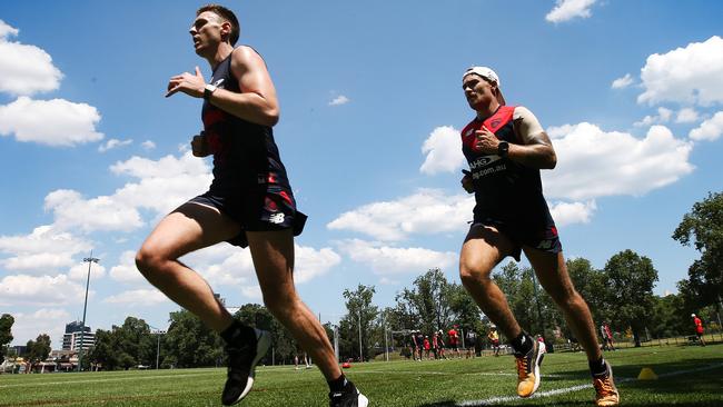 Melbourne training at Gosch's Paddock. Jake Lever and Dean Kent run laps. Pic: Michael Klein