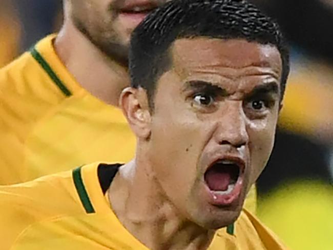 Australia's Tim Cahill celebrates with his teammates after scoring a goal during the 2018 World Cup qualifying football match between Australia and Syria at Stadium Australia in Sydney, Tuesday, October 10, 2017.(AAP Image/David Moir) NO ARCHIVING, EDITORIAL USE ONLY