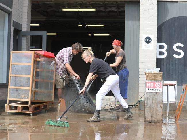 A Mullumbimby resident cleaning up. Picture: Liana Boss