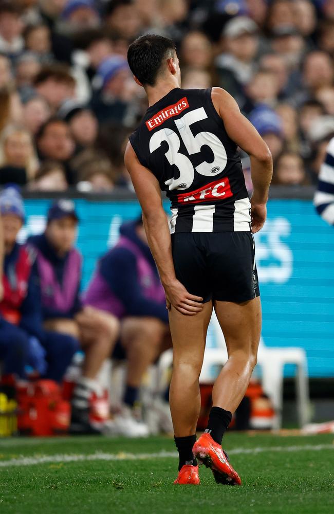 Nick Daicos of the Magpies holds his hamstring on Friday night. Picture: Michael Willson/AFL Photos via Getty Images.