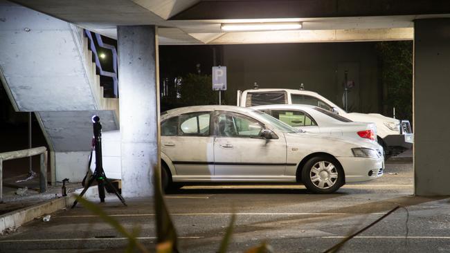 Forensics officers working through the night conducting fingerprinting of all vehicles in the car park where former Comanchero bikie boss Mahmoud "Mick" Hawi was shot dead. Picture: Damian Hofman