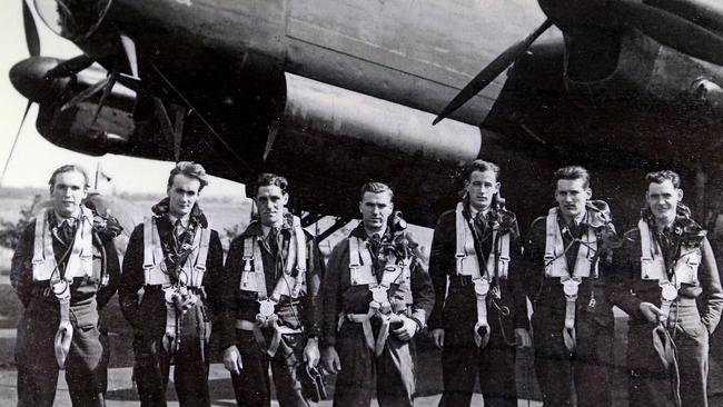 Rodney Tonkin, the shorter man in the centre of the photo, with his flying unit during the war.