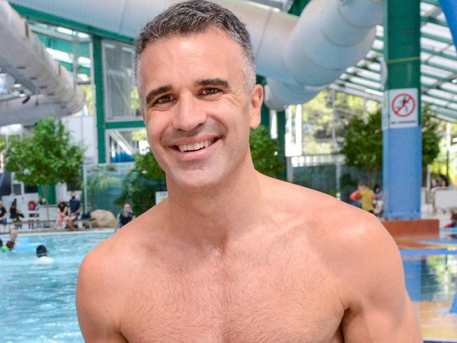 FEBRUARY 12, 2022: Peter Malinauskas with his daughter Eliza at the Adelaide Aquatic Centre in North Adelaide where he announced plans to redevelop the site if Labor wins the March election. Picture: Brenton Edwards