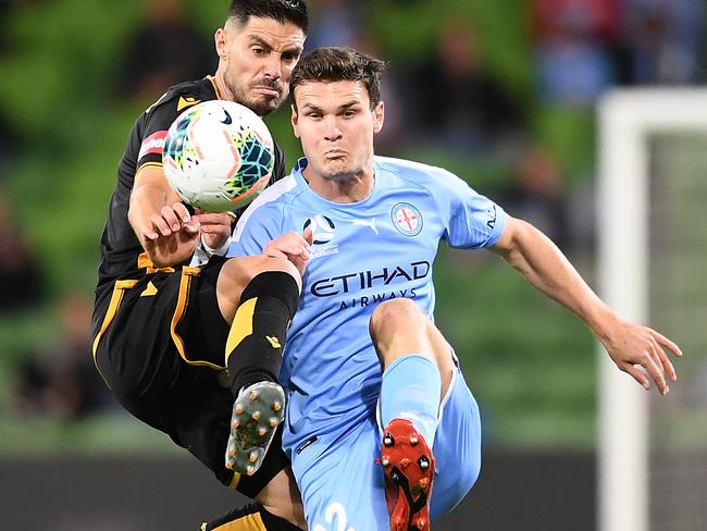 Melbourne City defender Curtis Good, right, tackles former teammate, Perth Glory’s Bruno Fornaroli. Picture: Getty Images