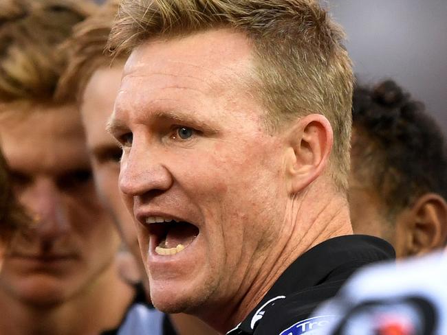 Collingwood coach Nathan Buckley chats with his players  at the break during the Round 2 AFL match between the Collingwood Magpies and the Greater Western Sydney (GWS) Giants at the MCG in Melbourne, Saturday, March 31, 2018. (AAP Image/Joe Castro) NO ARCHIVING, EDITORIAL USE ONLY