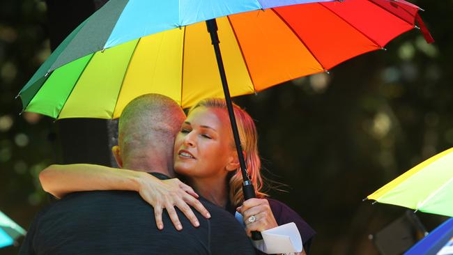 Sarah Murdoch embraces Ian Roberts after his emotional speech at the launch of Qtopia Sydney. Picture: Richard Dobson