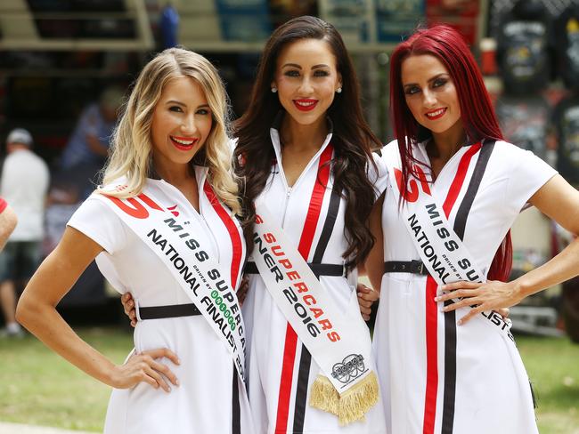 Action from the Gold Coast 600 Supercars race, held at the Surfers Paradise street circuit, Gold Coast. (L-R) Miss Supercars contestant Nicole Hall, Miss Supercars 2016 Charlotte Cushing and Miss Supercars contestant Emma James. Picture: BRENDAN RADKE