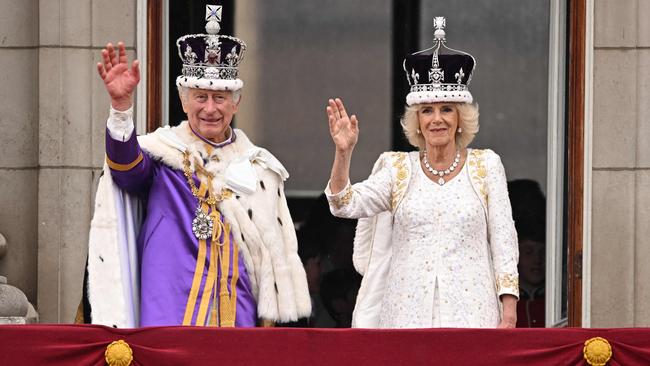 King Charles and Queen Camilla waving to the crowd from Buckingham Palace after their coronation in May. Picture: Oli Scarff/AFP