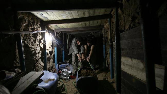 Men repair a smuggling tunnel in the border town of Rafah between Egypt and the southern Gaza Strip. Picture: AFP