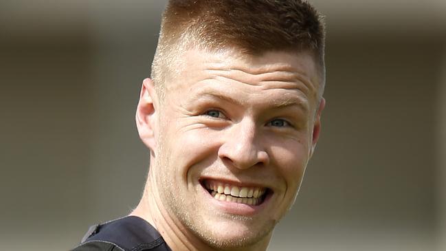 Jordan De Goey was all smiles after training with the main group on Monday. Picture: Darrian Traynor/Getty Images.