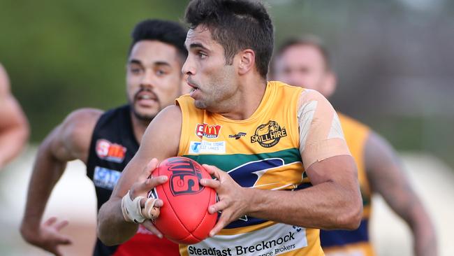 Jared Petrenko on the run during the final quarter as the Eagles and Bloods clash at Woodville Oval. Picture: Stephen Laffer