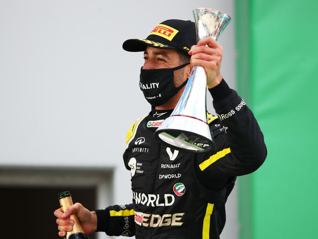 Third-placed Daniel Ricciardo of Australia celebrates on the podium.