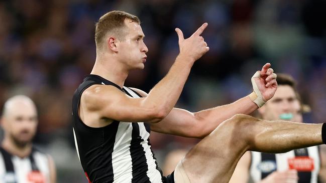 MELBOURNE, AUSTRALIA - JUNE 10: Nathan Kreuger of the Magpies kicks a goal during the 2024 AFL Round 13 match between the Collingwood Magpies and the Melbourne Demons at The Melbourne Cricket Ground on June 10, 2024 in Melbourne, Australia. (Photo by Michael Willson/AFL Photos via Getty Images)