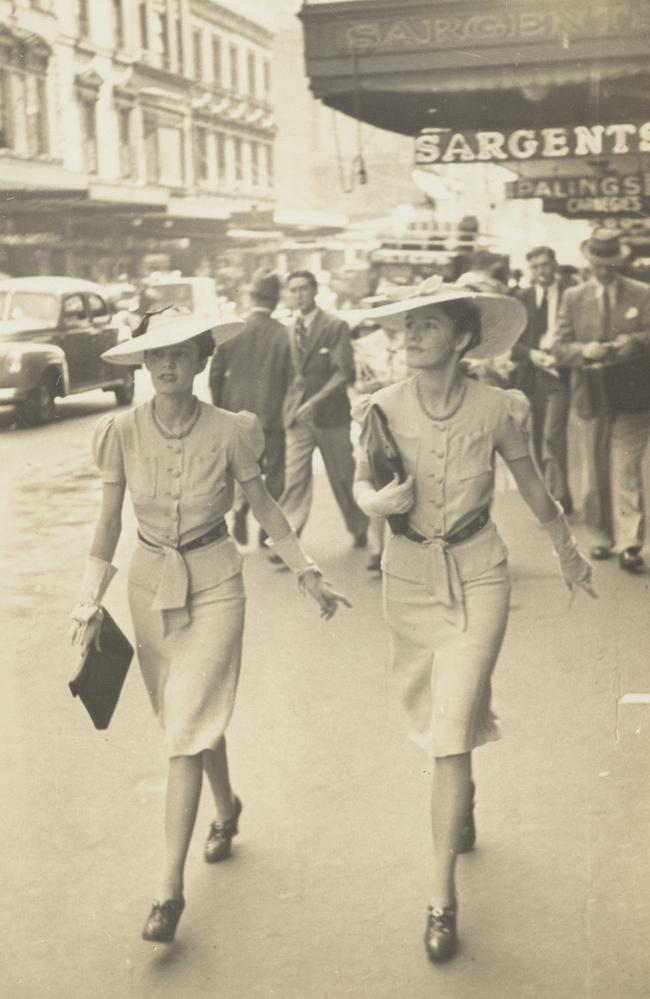 Twins Jean and Clarice Cathro walk in step alon George St in the 1930s. Picture: Supplied