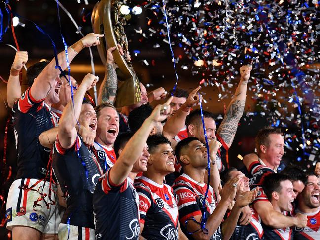 The Sydney Roosters celebrate after defeating the Raiders  during the 2019 NRL Grand Final between the Canberra Raiders and the Sydney Roosters at ANZ Stadium in Sydney, Sunday, October 6, 2019. (AAP Image/Dean Lewins) NO ARCHIVING, EDITORIAL USE ONLY