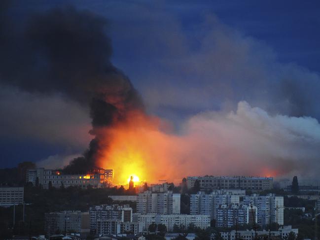 Fire and smoke rise from the site where a Russian missile struck a residential area in Kharkiv, Ukraine, Saturday, June 7, 2025, (AP Photo/Anatolii Lysianskyi)