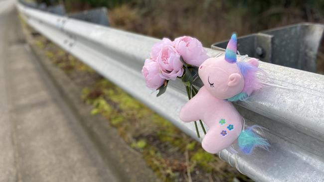 Floral tributes and a small toy unicorn at the fatal crash site on Algona Road, where a Huntingfield father and his young daughter were killed in a car crash. Photo: Phil Young