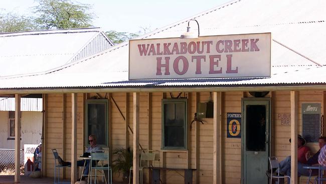 Paul Hogan sits on the veranda of the reconstructed Walkabout Creek hotel on location in McKinlay during the filming of Crocodile Dundee 3 in August, 2000. Picture: Rob Maccoll