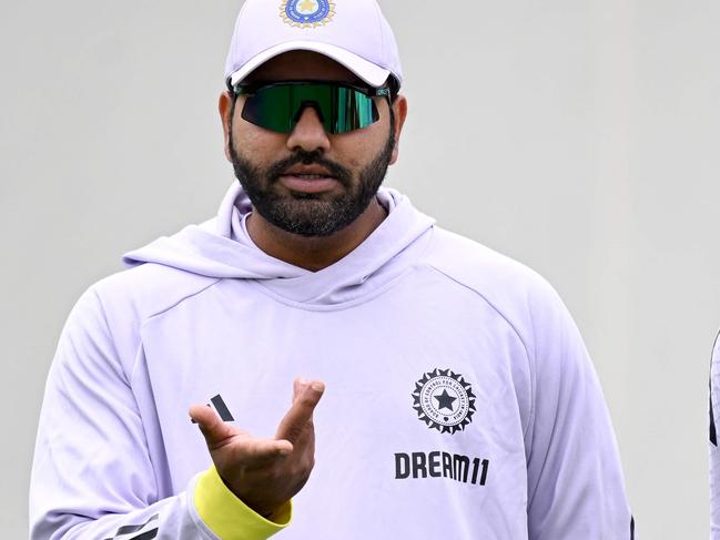 Indiaâs Rohit Sharma (L) chats with a teammate Jasprit Bumrah during a practice session ahead of the fifth cricket Test match between Australia and India at the Sydney Cricket Ground in Sydney on January 2, 2025. (Photo by Saeed KHAN / AFP) / -- IMAGE RESTRICTED TO EDITORIAL USE - STRICTLY NO COMMERCIAL USE --