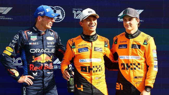 Red Bull’s Max Verstappen of the Netherlands and McLaren pair Lando Norris and Oscar Piastri after qualifying for the Dutch Grand Prix. (Photo by Mark Thompson/Getty Images)