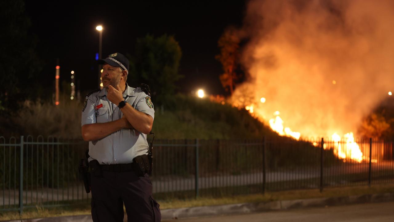 NSW Police clear the scene of a fire at Leagues Club Park. (Photo by Scott Gardiner/Getty Images)