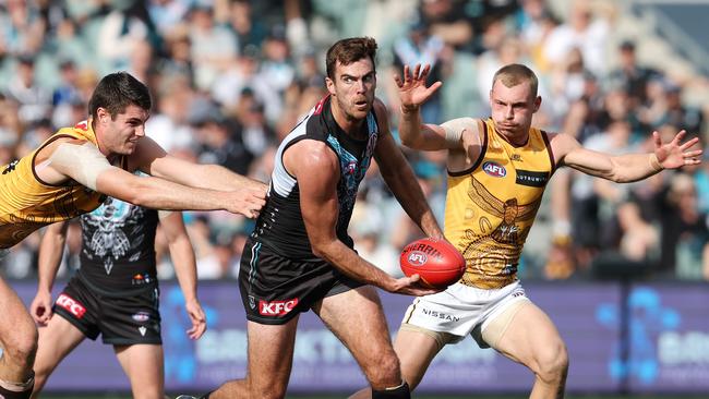 Scott Lycett wins a clearance against Hawthorn. Picture: Sarah Reed/AFL Photos via Getty Images