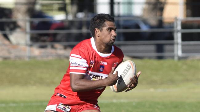 Rebels' young flier Tom McGrady takes off around a defender during the South Grafton Rebels and Coffs Harbour Comets Group 2 major semi-final at McKittrick Park.