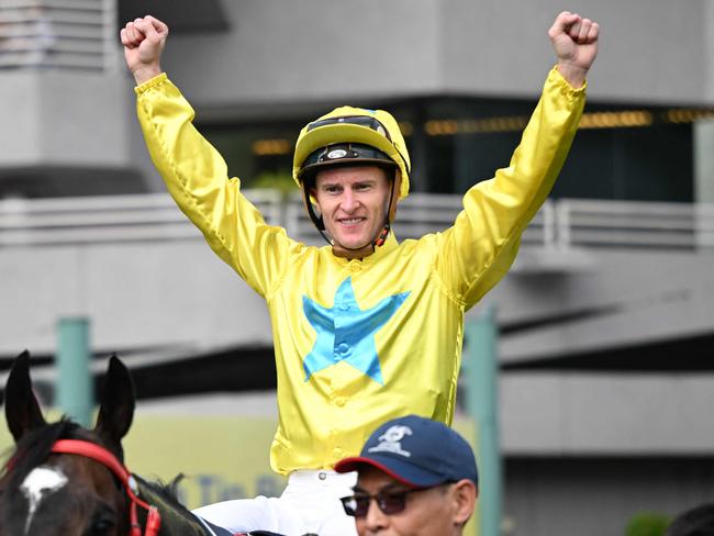 Lucky Sweynesse ridden by Zac Purton celebrates winning the Group 1 Sprint race during the Hong Kong International Races at Sha Tin Racecourse in Hong Kong on December 10, 2023. (Photo by Peter PARKS / AFP)