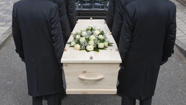 Bearers carrying a coffin.