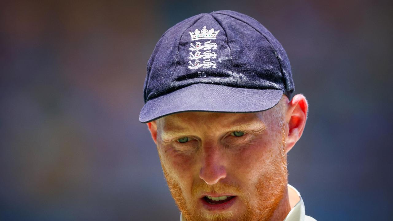 England's Ben Stokes reacts during day two of the first Ashes cricket Test match between England and Australia at the Gabba in Brisbane on December 9, 2021. (Photo by Patrick HAMILTON / AFP) / -- IMAGE RESTRICTED TO EDITORIAL USE - STRICTLY NO COMMERCIAL USE --