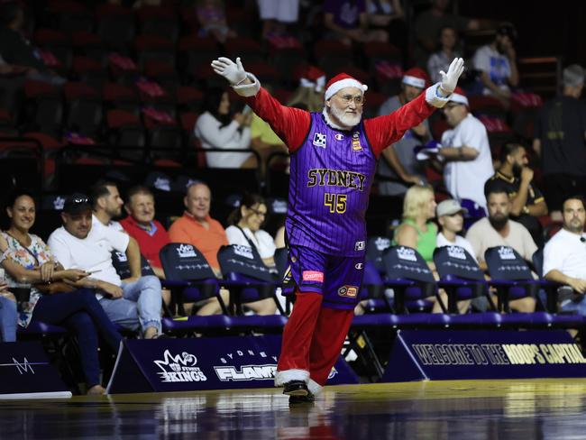 Santa Claus arrives ahead of the 2022 Christmas Day NBL match between Sydney Kings and Melbourne United at Qudos Bank Arena. Photo: Mark Evans/Getty Images.