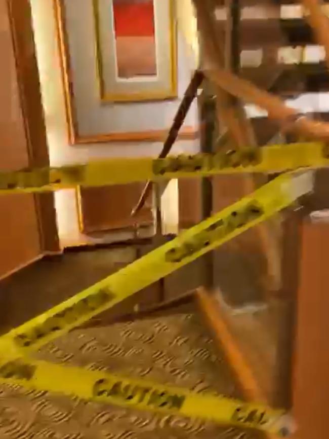 Parts of the ship’s hallway roped off with tape.