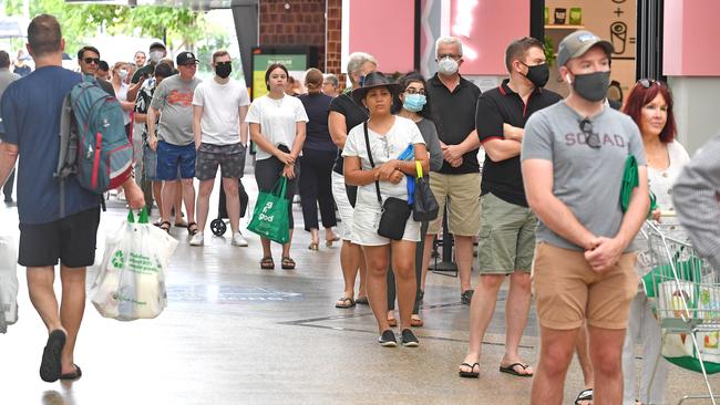 Queues stretched out into the streets. Picture: NewsWire/John Gass