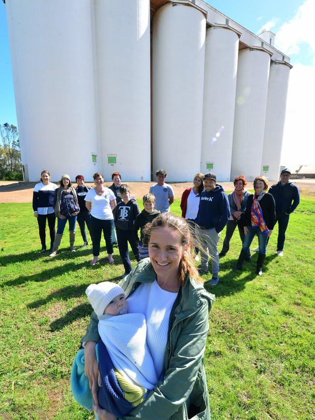 Nicci Southern and baby Saylor with other members of the Tumby Bay community supporting a silo and street art project in the Eyre Peninsula town. Picture: Bernard Humphreys