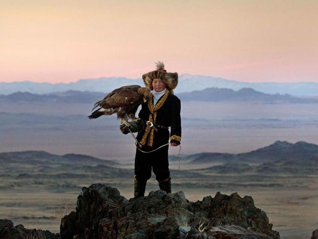 Aisholpan Nurgaiv stands against the spectacular backdrop of the Altai Mountains in Mongolia. Picture: Asher Svidensky